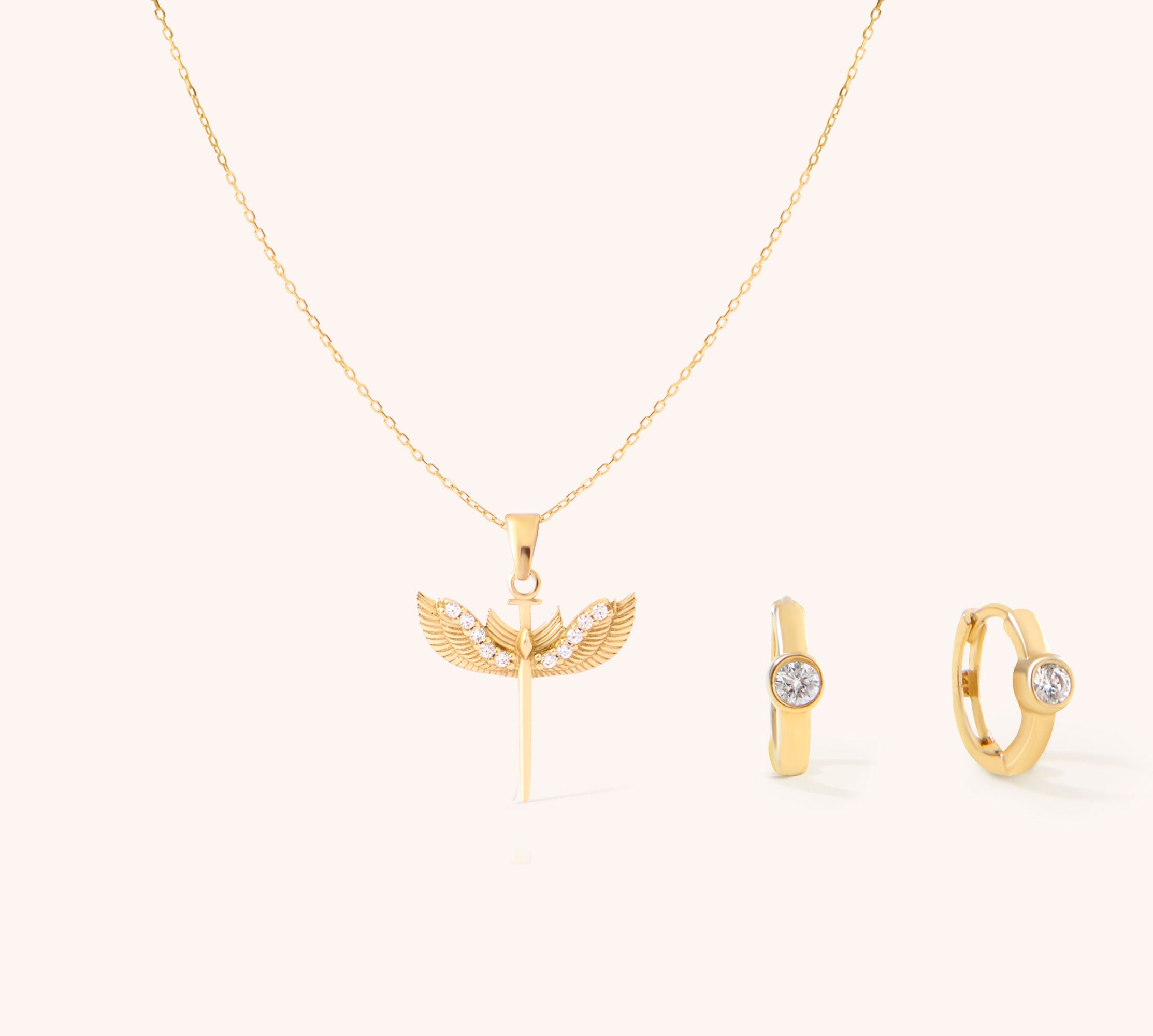 14K Real Solid Gold Archangel Saint Michael Necklace featuring a winged sword design alongside a pair of 14K Solid Gold Diamond Huggie Hoop Earrings. 