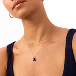 Navy blue evil eye bead necklace crafted in 14K solid yellow gold. A stylish and meaningful accessory, perfect for everyday wear or as a protective talisman.