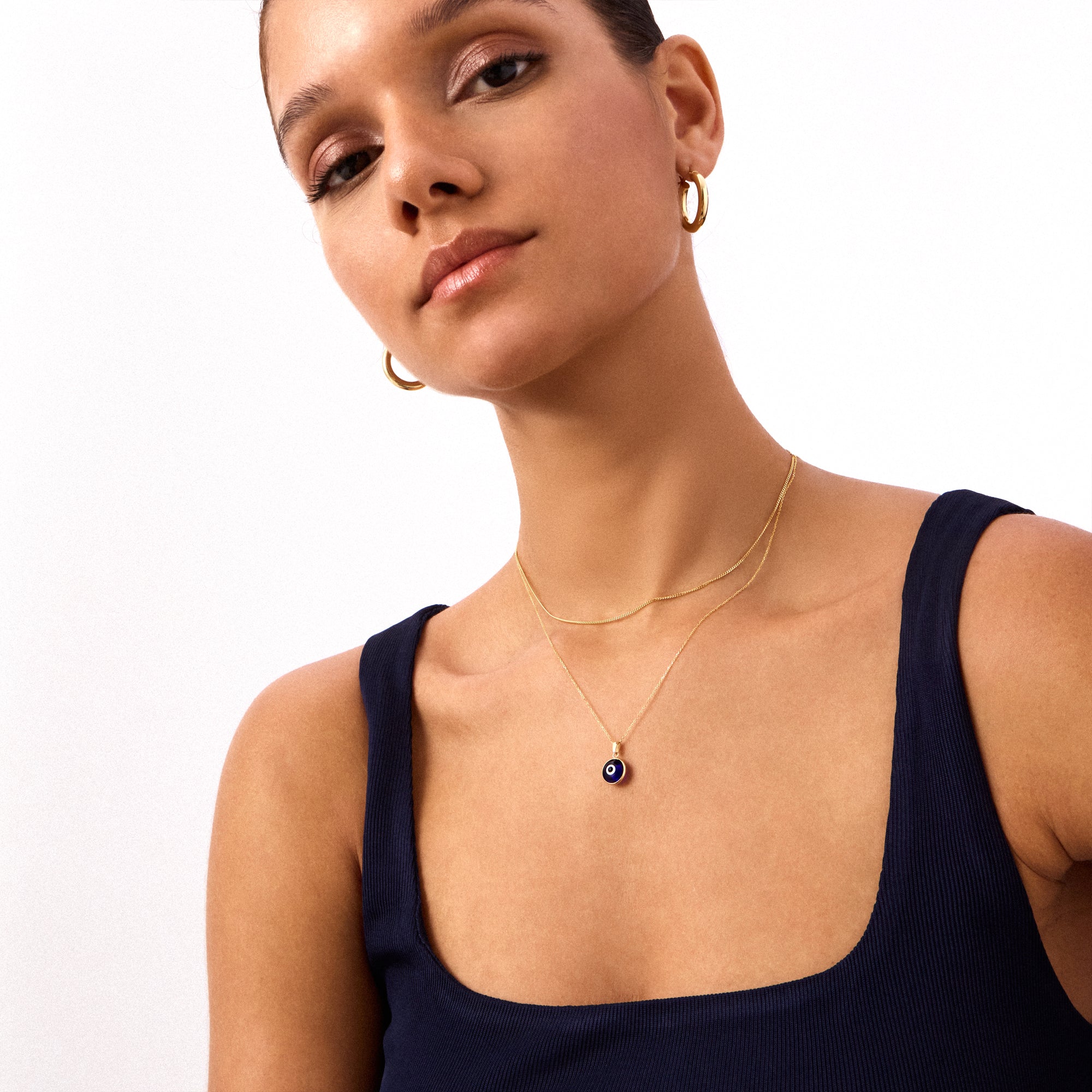 Navy blue evil eye bead necklace crafted in 14K solid yellow gold. A stylish and meaningful accessory, perfect for everyday wear or as a protective talisman.