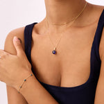 Navy blue evil eye bead necklace crafted in 14K solid yellow gold. A stylish and meaningful accessory, perfect for everyday wear or as a protective talisman.