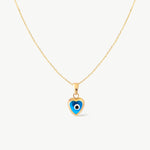 Blue heart evil eye necklace in 14K yellow gold. A dainty protective charm necklace with a modern design, ideal for adding a touch of luck and style to any outfit.