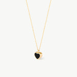 14K real solid gold heart-shaped pendant necklace featuring a minimalist black enamel design. A dainty and elegant charm perfect for everyday wear or as a heartfelt gift for special occasions.