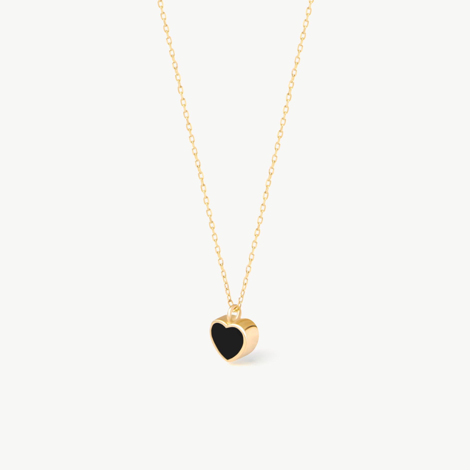 14K real solid gold heart-shaped pendant necklace featuring a minimalist black enamel design. A dainty and elegant charm perfect for everyday wear or as a heartfelt gift for special occasions.