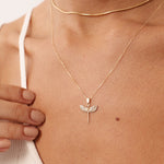 Solid 14K yellow gold necklace with a Saint Michael pendant showcasing angel wings and a sword, adorned with diamond accents. A powerful symbol of protection and divine strength, ideal for both religious and personal expression.