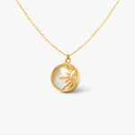 14K solid yellow gold necklace with a radiant sun pendant, featuring a mother of pearl backdrop. This unique celestial design symbolizes warmth and vitality, creating a stunning, elegant jewelry piece perfect for any occasion.