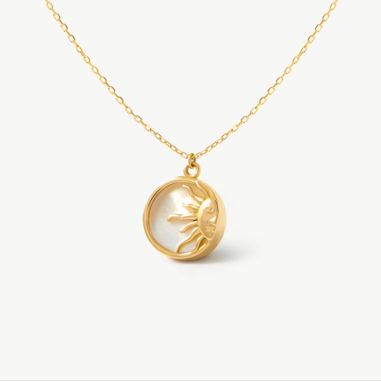 14K solid yellow gold necklace with a radiant sun pendant, featuring a mother of pearl backdrop. This unique celestial design symbolizes warmth and vitality, creating a stunning, elegant jewelry piece perfect for any occasion.