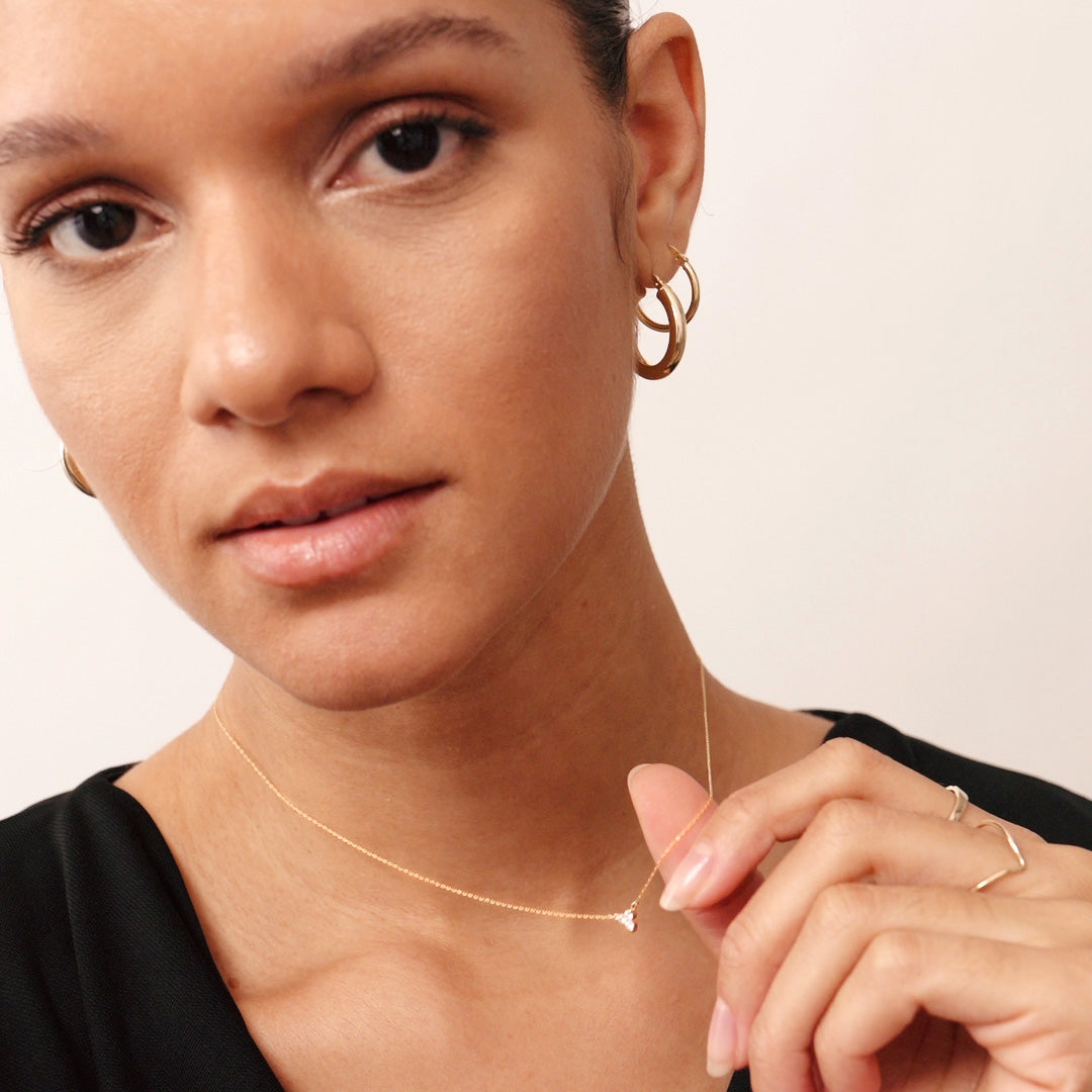 14K Real Solid Gold Diamond Trio Necklace featuring three F color, perfectly clear diamonds. This dainty, elegant piece is ideal for layering or wearing alone, adding refined sparkle and sophistication to any outfit.