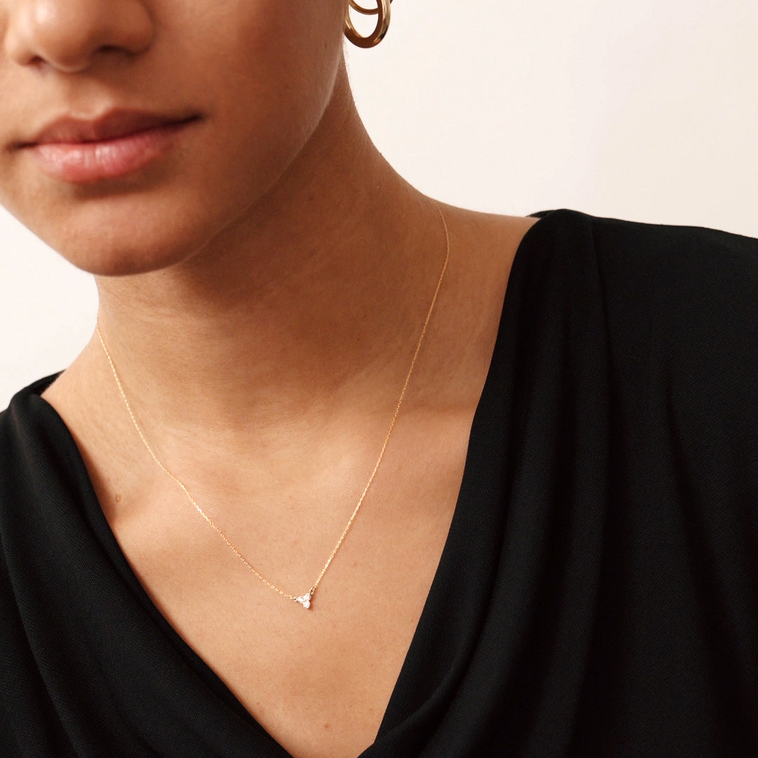 14K Real Solid Gold Diamond Trio Necklace featuring three F color, perfectly clear diamonds. This dainty, elegant piece is ideal for layering or wearing alone, adding refined sparkle and sophistication to any outfit.