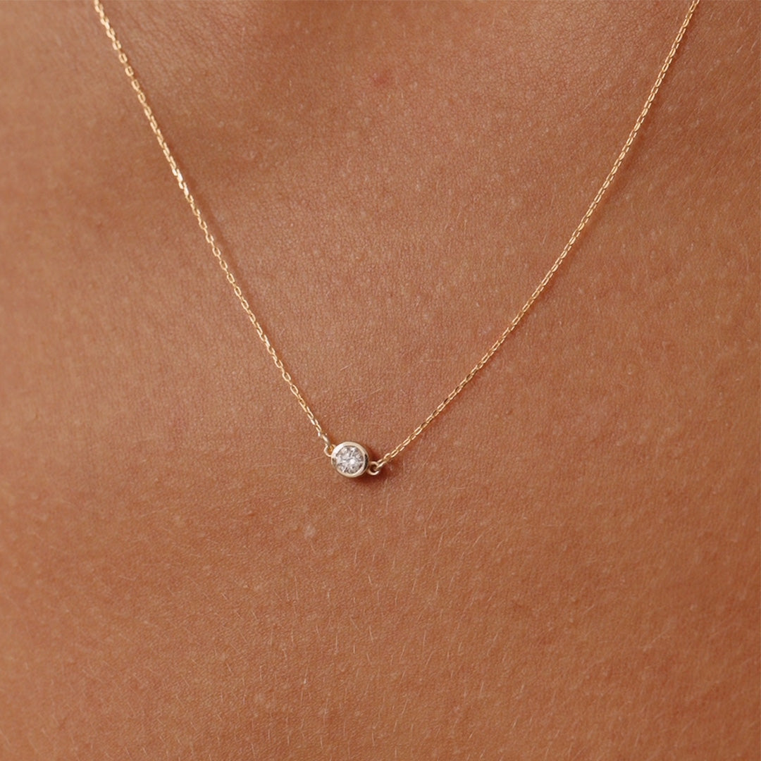 14K Real Solid Gold necklace with an F color solitaire diamond in a bezel setting, showcasing minimalist elegance and perfect for gifting or daily wear. Ideal for those who value understated luxury.
