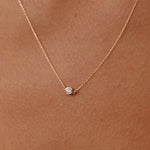 14K Real Solid Gold necklace with an F color solitaire diamond in a bezel setting, showcasing minimalist elegance and perfect for gifting or daily wear. Ideal for those who value understated luxury.