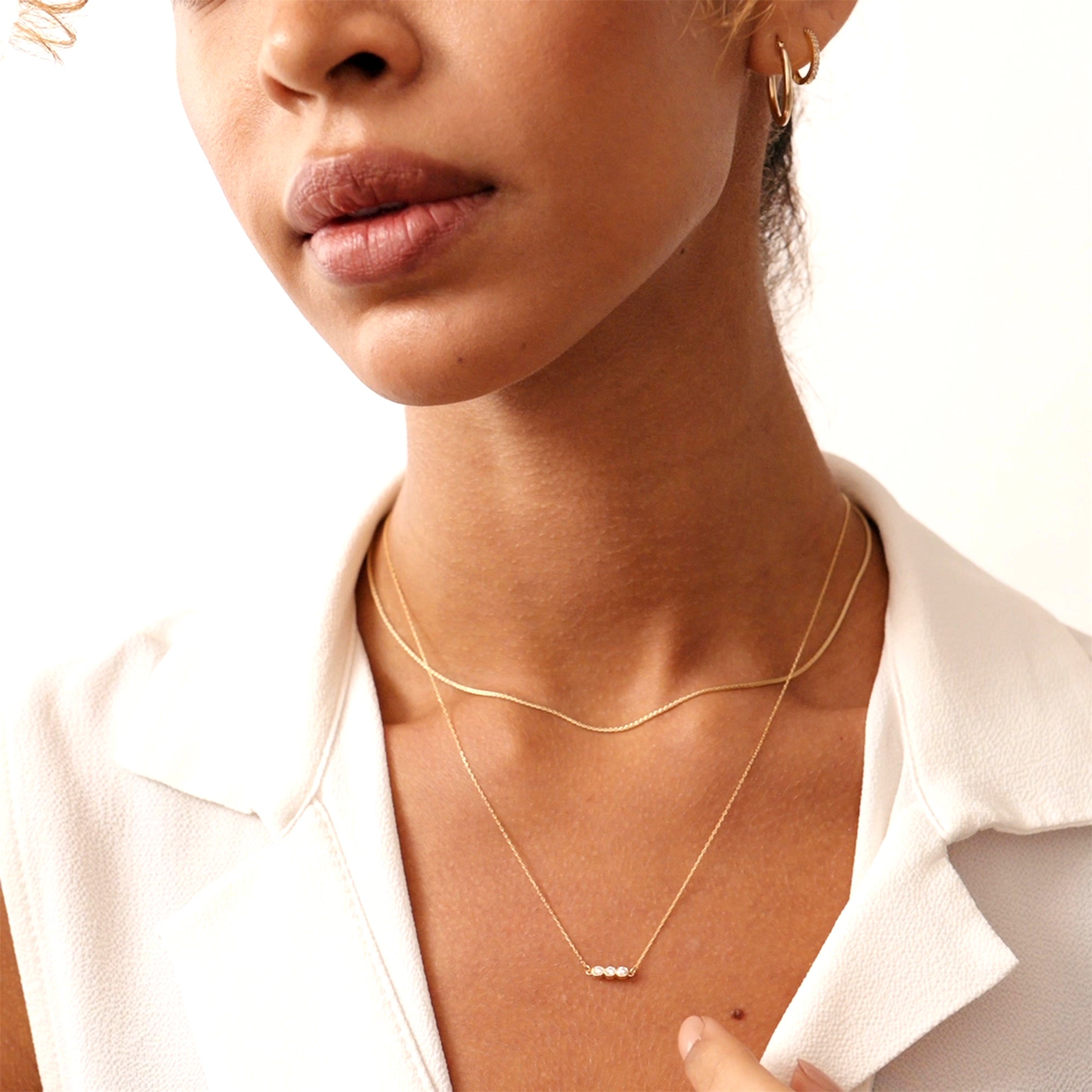 14K gold diamond bezel necklace with three bezel-set diamonds in a sleek linear design, perfect for anniversaries, birthdays, or everyday wear, adding elegance and sparkle to any outfit.