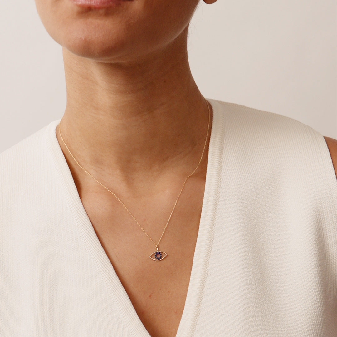 14K Real Solid Gold Evil Eye Necklace featuring a blue sapphire gemstone, a protective charm pendant for women offering elegance and spiritual significance.