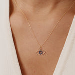 14K Real Solid Gold Evil Eye Necklace featuring a blue sapphire gemstone, a protective charm pendant for women offering elegance and spiritual significance.