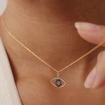 14K Real Solid Gold Evil Eye Necklace featuring a blue sapphire gemstone, a protective charm pendant for women offering elegance and spiritual significance.