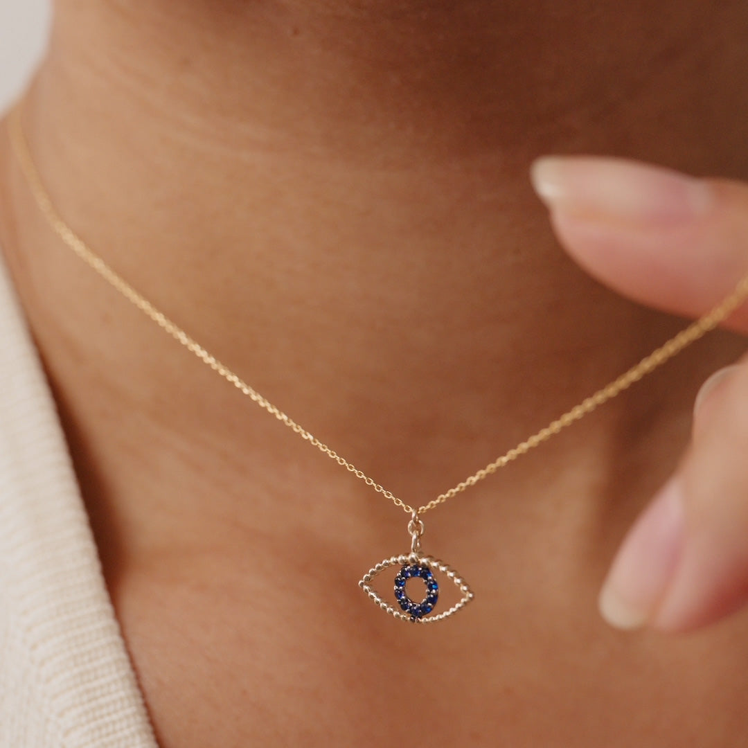 14K Real Solid Gold Evil Eye Necklace featuring a blue sapphire gemstone, a protective charm pendant for women offering elegance and spiritual significance.