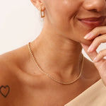 A 14K real solid gold thick rope chain necklace with a twisted design, featuring a lobster clasp closure, suitable for men and women, available in 14, 16, 18, and 20 inches, perfect for layering or as a standalone accessory.