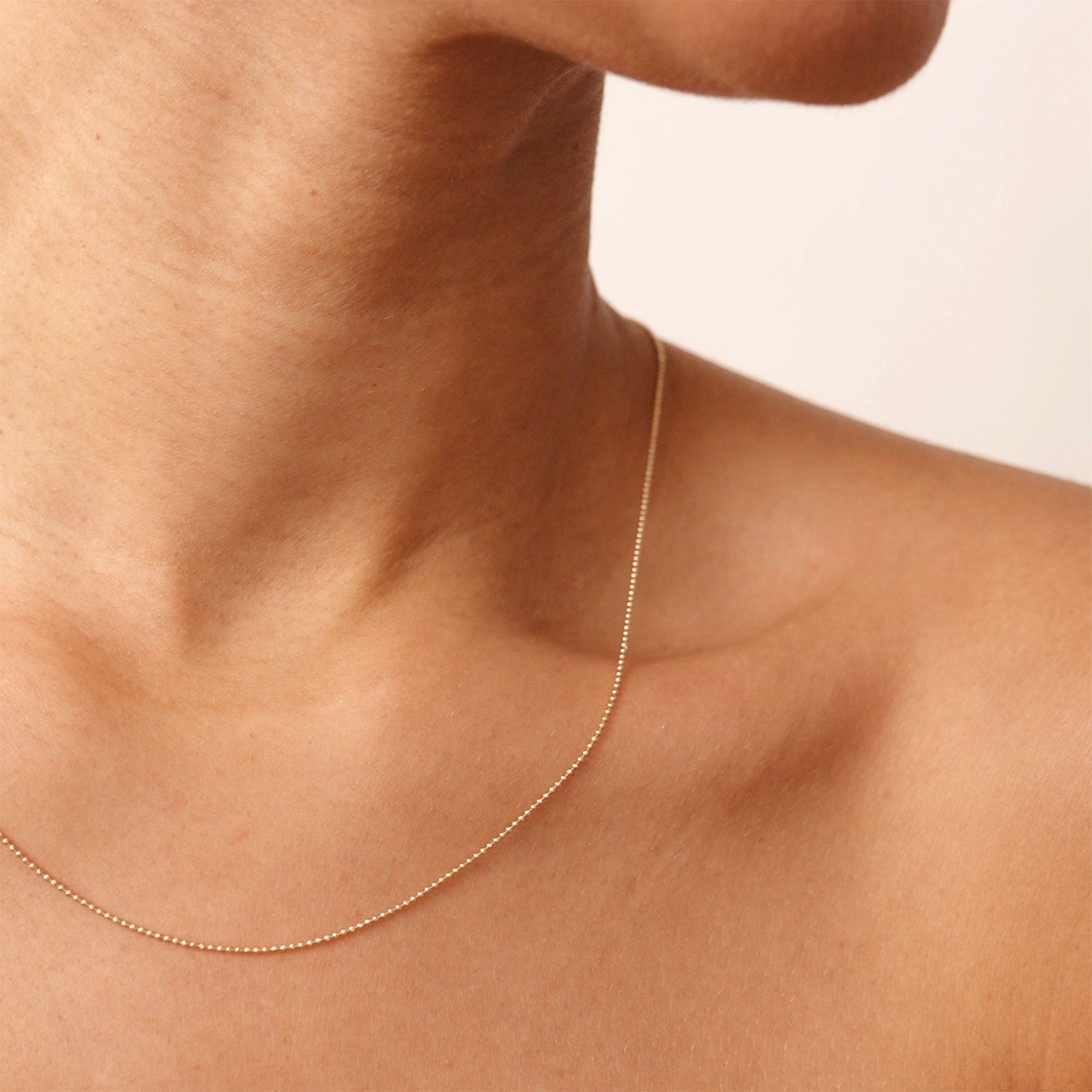 14K gold beaded necklace with smooth gold ball chain, available in 14, 16, 18, and 20-inch lengths, perfect for layering or wearing solo as a minimalist statement piece. Ideal gift for her, offering elegance and versatility.