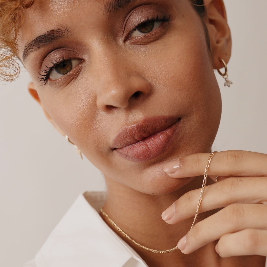 14K Real Solid Gold Figaro Chain Necklace with alternating short and elongated links, available in 14, 16, 18, and 20 inches; a classic and elegant piece suitable for layering or standalone wear, perfect as a gift.