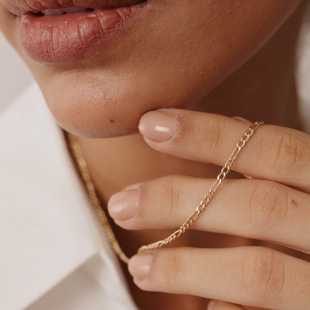 14K Real Solid Gold Figaro Chain Necklace with alternating short and elongated links, available in 14, 16, 18, and 20 inches; a classic and elegant piece suitable for layering or standalone wear, perfect as a gift.