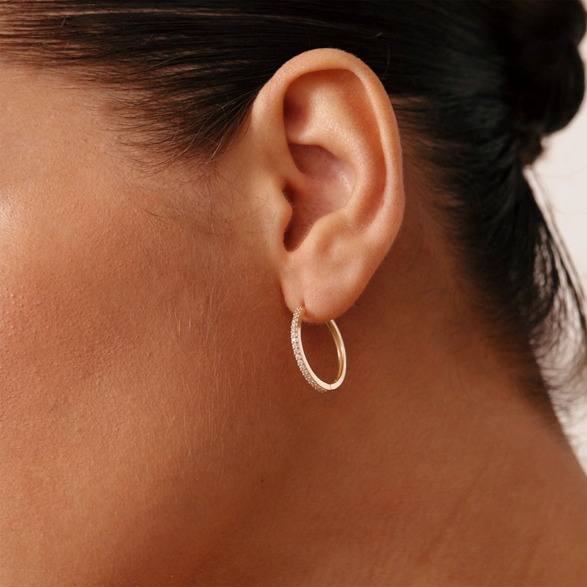 14K real solid gold huggie hoop earrings with cubic zirconia stones, standard size with secure hinged clasp, perfect for stacking or wearing alone, a beautiful accessory for daily wear or as a gift for special occasions.