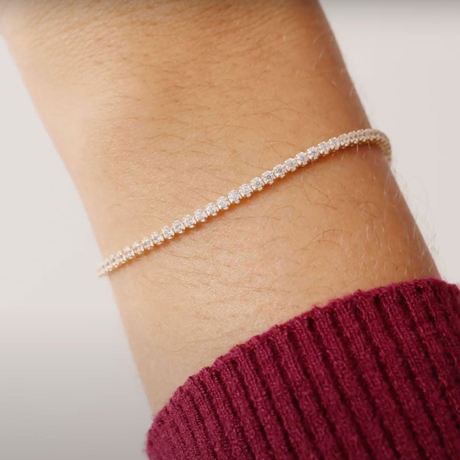 14K Real Solid Gold Cubic Zirconia Tennis Bracelet with a continuous line of cubic zirconia stones, perfect for adding sparkle to any outfit; ideal as a gift for birthdays, anniversaries, or special occasions.