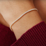 14K Real Solid Gold Cubic Zirconia Tennis Bracelet with a continuous line of cubic zirconia stones, perfect for adding sparkle to any outfit; ideal as a gift for birthdays, anniversaries, or special occasions.