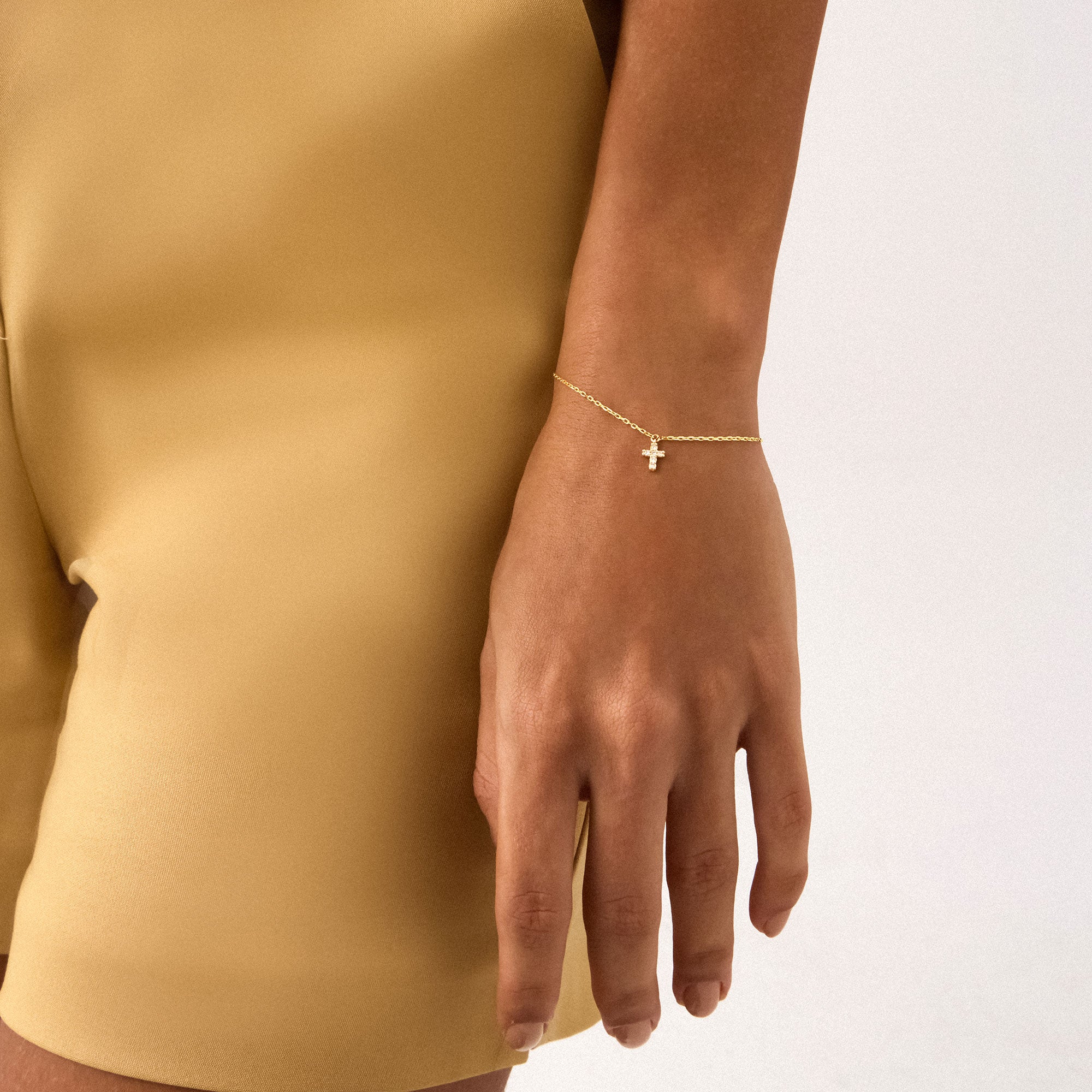 14K Real Solid Gold Cross Bracelet with F color diamonds, showcasing an elegant cross charm on a delicate gold chain, perfect for baptism gifts and religious occasions.