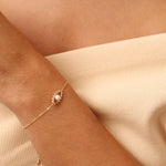 Dainty 14K gold evil eye bracelet with an adjustable chain and lobster clasp, featuring a delicate charm symbolizing protection and good fortune. Perfect for gifting as a Christmas present, birthday gift, or friendship bracelet. Ideal for everyday wear and layering.