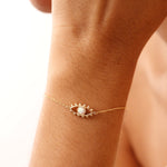 Dainty 14K gold evil eye bracelet with an adjustable chain and lobster clasp, featuring a delicate charm symbolizing protection and good fortune. Perfect for gifting as a Christmas present, birthday gift, or friendship bracelet. Ideal for everyday wear and layering.