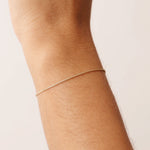 14K Real Solid Gold Wheat Chain Bracelet with an adjustable length and secure spring ring clasp, featuring an elegant and durable wheat chain link design.