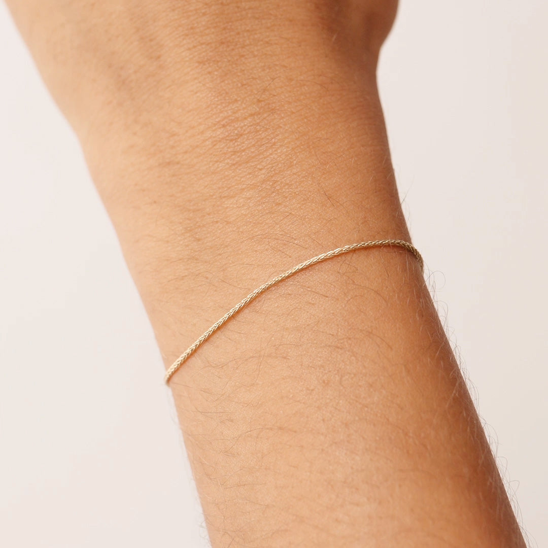 14K Real Solid Gold Wheat Chain Bracelet with an adjustable length and secure spring ring clasp, featuring an elegant and durable wheat chain link design.