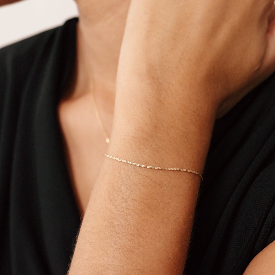 14K Real Solid Gold Wheat Chain Bracelet with an adjustable length and secure spring ring clasp, featuring an elegant and durable wheat chain link design.