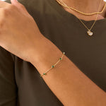 14K Real Solid Gold Emerald Bead Station Bracelet featuring vibrant green gemstones set along a dainty gold chain, perfect as a birthstone bracelet or gift for Mother's Day and special occasions.