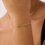 14K gold bracelet featuring beaded aquamarine stones, showcasing an elegant and timeless design, perfect for March birthstone jewelry and gifting occasions.