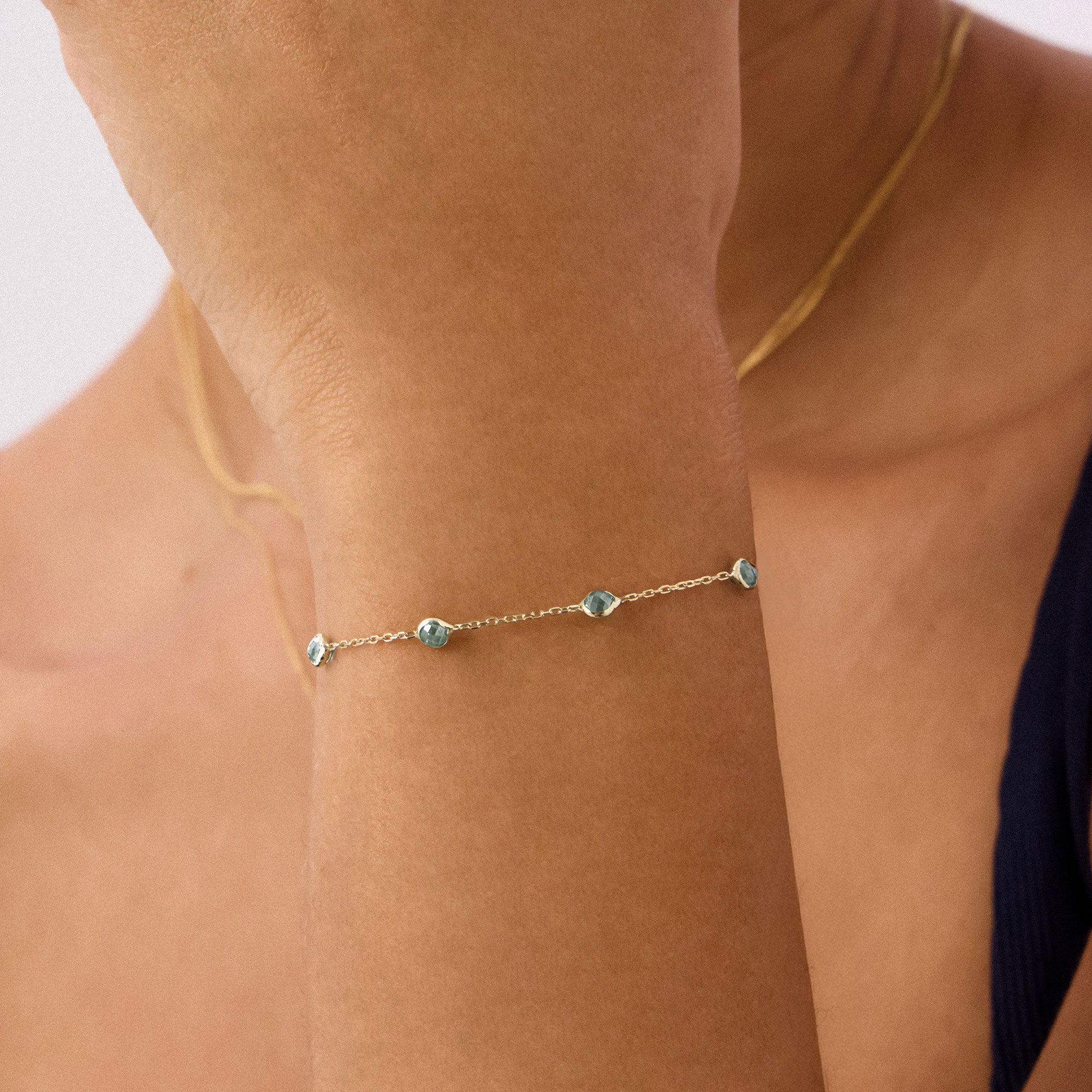 14K gold bracelet featuring beaded aquamarine stones, showcasing an elegant and timeless design, perfect for March birthstone jewelry and gifting occasions.