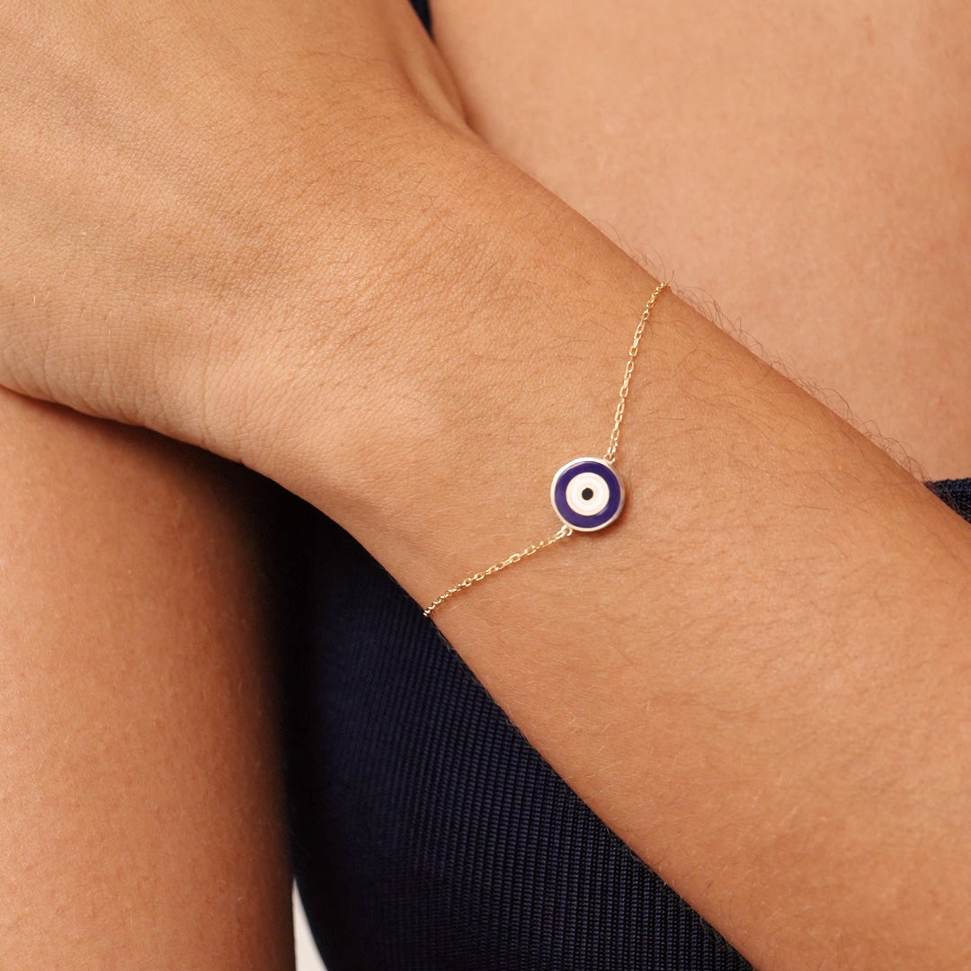 14K Real Solid Gold Navy Blue Evil Eye Bracelet with blue enamel charm, representing protection and good luck, with an adjustable gold chain for a secure fit.