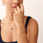 14K Real Solid Gold Navy Blue Evil Eye Bracelet with blue enamel charm, representing protection and good luck, with an adjustable gold chain for a secure fit.