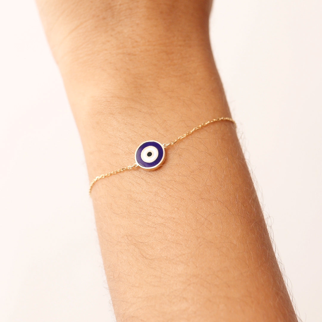 14K Real Solid Gold Navy Blue Evil Eye Bracelet with blue enamel charm, representing protection and good luck, with an adjustable gold chain for a secure fit.