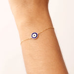14K Real Solid Gold Navy Blue Evil Eye Bracelet with blue enamel charm, representing protection and good luck, with an adjustable gold chain for a secure fit.