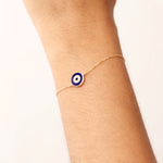 14K Real Solid Gold Navy Blue Evil Eye Bracelet with blue enamel charm, representing protection and good luck, with an adjustable gold chain for a secure fit.