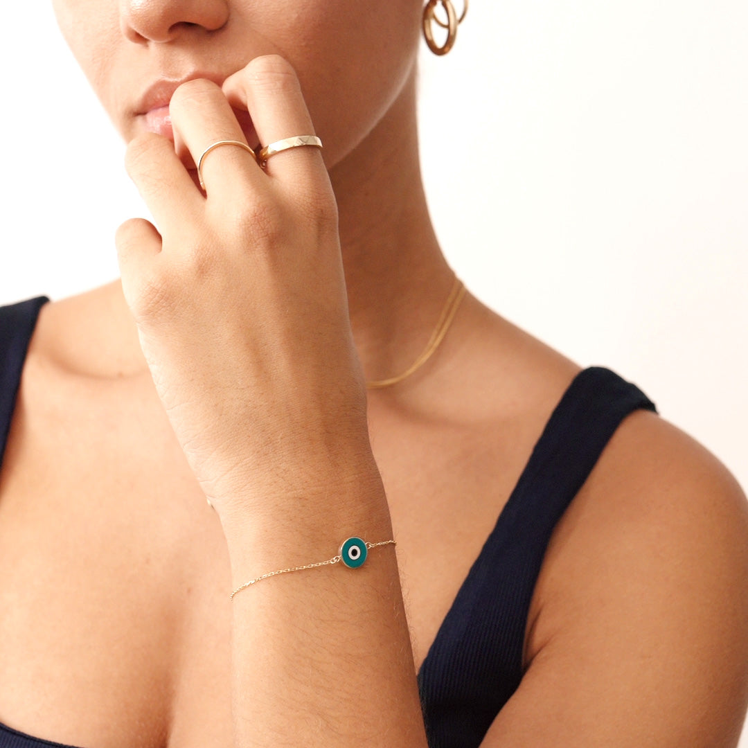 14K Real Solid Gold Bracelet with a turquoise enamel evil eye charm, representing protection and good luck, featuring an adjustable gold chain.