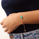 14K Real Solid Gold Bracelet with a turquoise enamel evil eye charm, representing protection and good luck, featuring an adjustable gold chain.