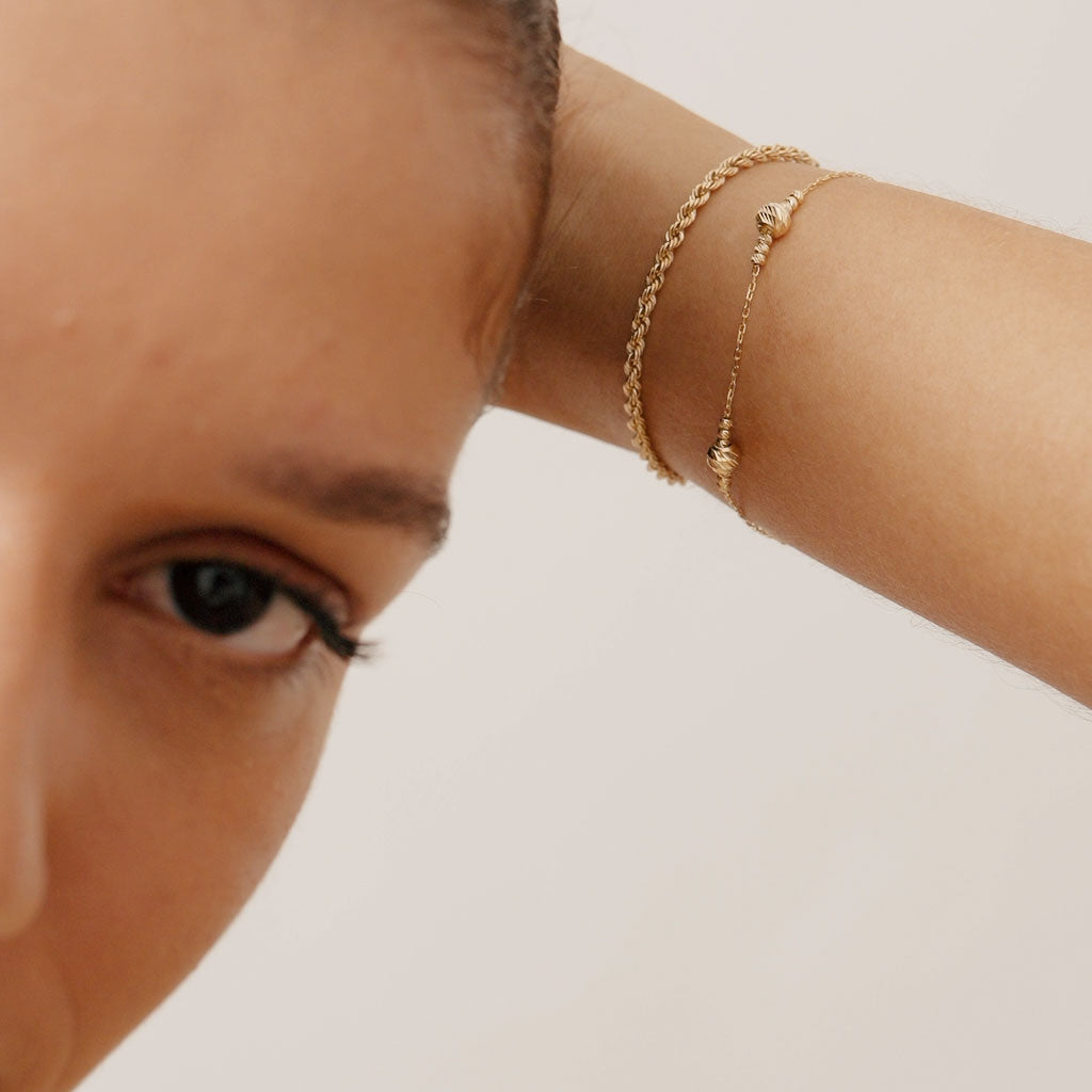 14K Real Solid Gold Bead Station Bracelet featuring dainty gold beads on a delicate gold chain, perfect as a stackable bracelet or thoughtful gift for women on occasions like Mother’s Day and Christmas.