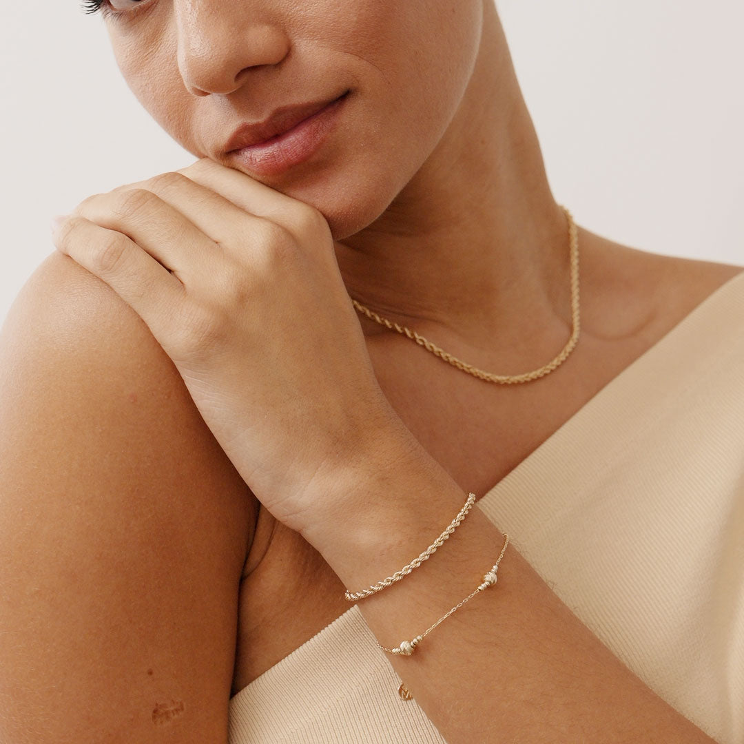 14K Real Solid Gold Bead Station Bracelet featuring dainty gold beads on a delicate gold chain, perfect as a stackable bracelet or thoughtful gift for women on occasions like Mother’s Day and Christmas.