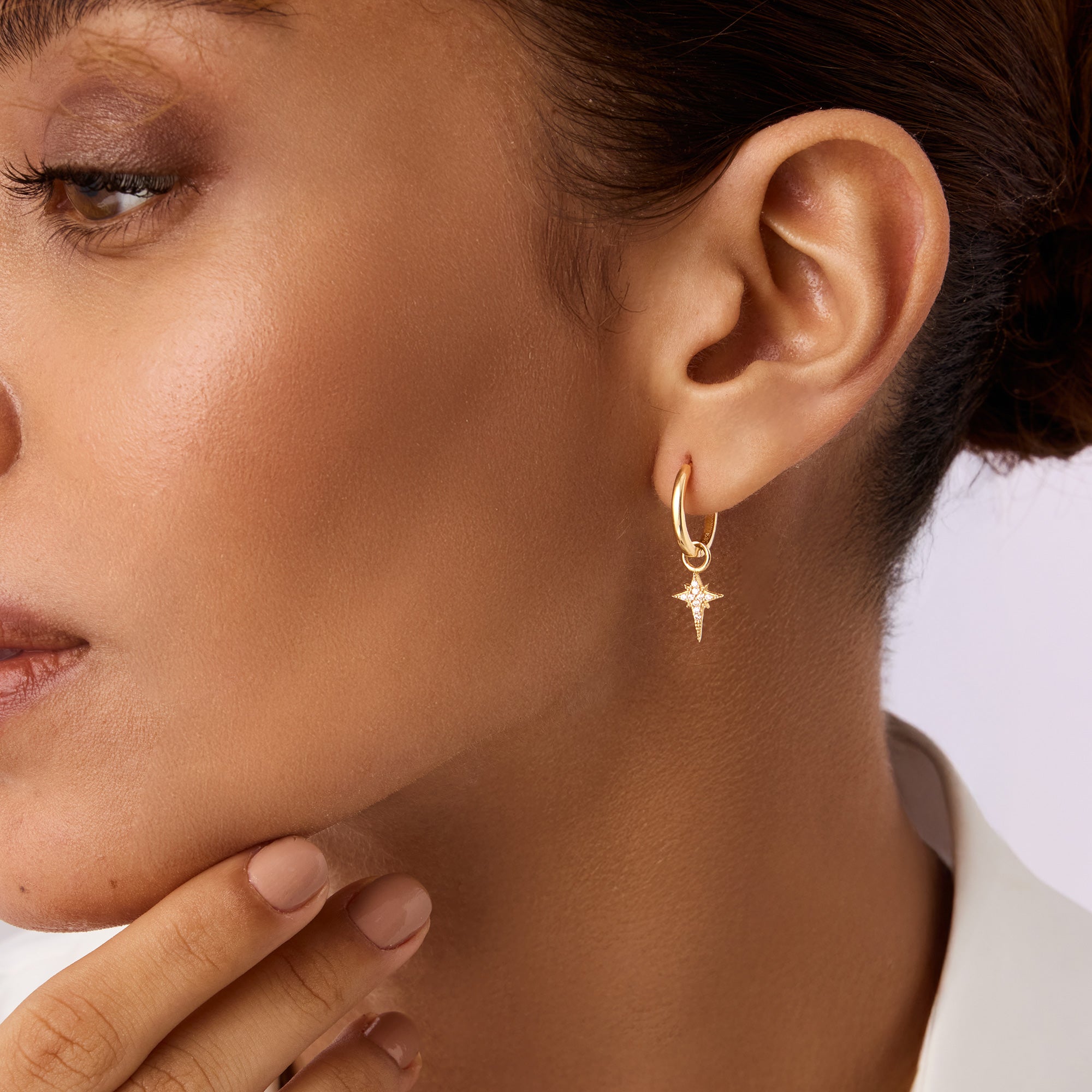 Elegant 14K Real Solid Gold North Star Earrings adorned with sparkling Cubic Zirconia Charms, perfect for adding a celestial touch to any ensemble.