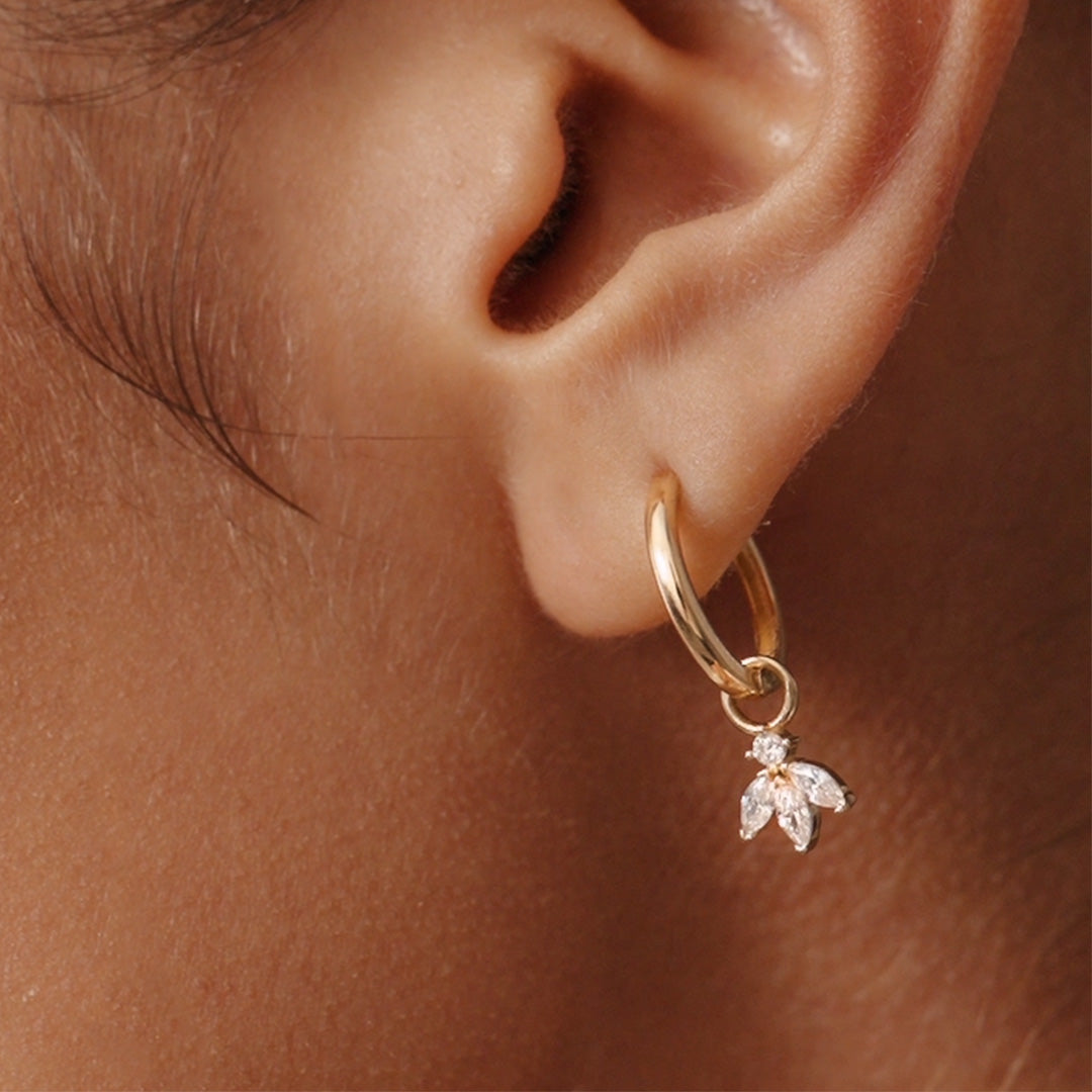 Luxurious 14K Real Solid Gold Hoop Earrings featuring sparkling Cubic Zirconia Charms, perfect for adding a sophisticated flair to any outfit.