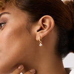 Luxurious 14K Real Solid Gold Hoop Earrings featuring sparkling Cubic Zirconia Charms, perfect for adding a sophisticated flair to any outfit.