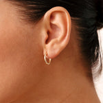 Luxurious 14K Real Solid Gold Hoop Earrings featuring sparkling Cubic Zirconia Charms, perfect for adding a sophisticated flair to any outfit.