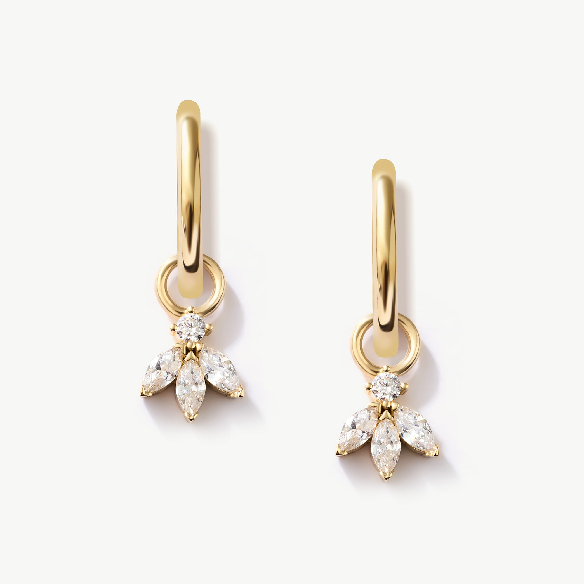 Luxurious 14K Real Solid Gold Hoop Earrings featuring sparkling Cubic Zirconia Charms, perfect for adding a sophisticated flair to any outfit.