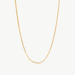 14K solid yellow gold snake chain necklace featuring a sleek, herringbone design. This minimalist and elegant chain offers a smooth, fluid texture, perfect for layering or wearing as a statement piece for everyday sophistication.
